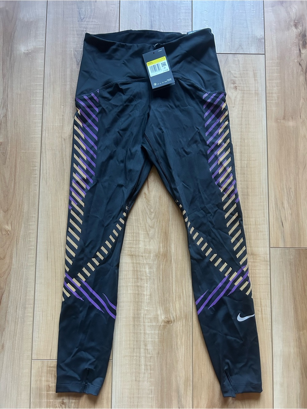 Nike Black Leggings with Purple and Gold Stripe Accents